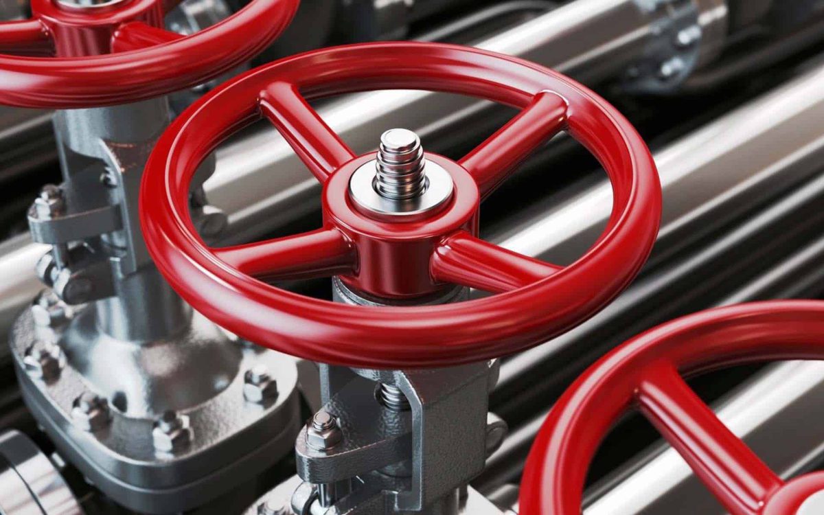 Válvulas industriales con manijas rojas, ideales para control de flujo en sistemas de tuberías.